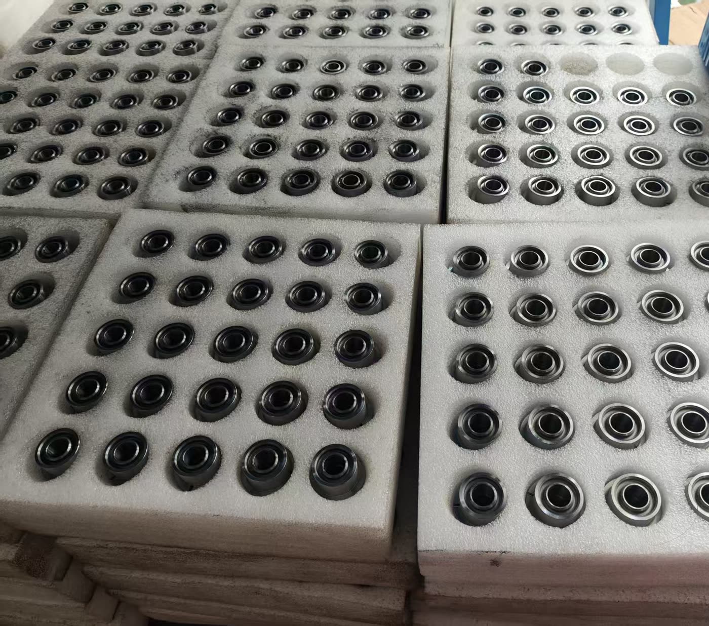 Small turned rings, batch packed