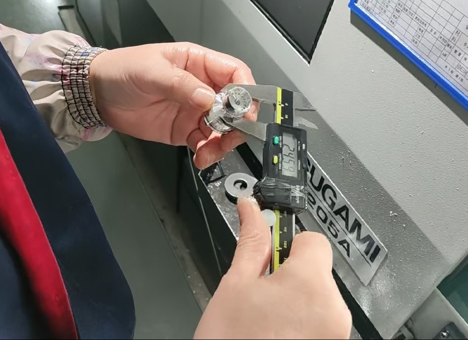 Digital caliper checking a small part