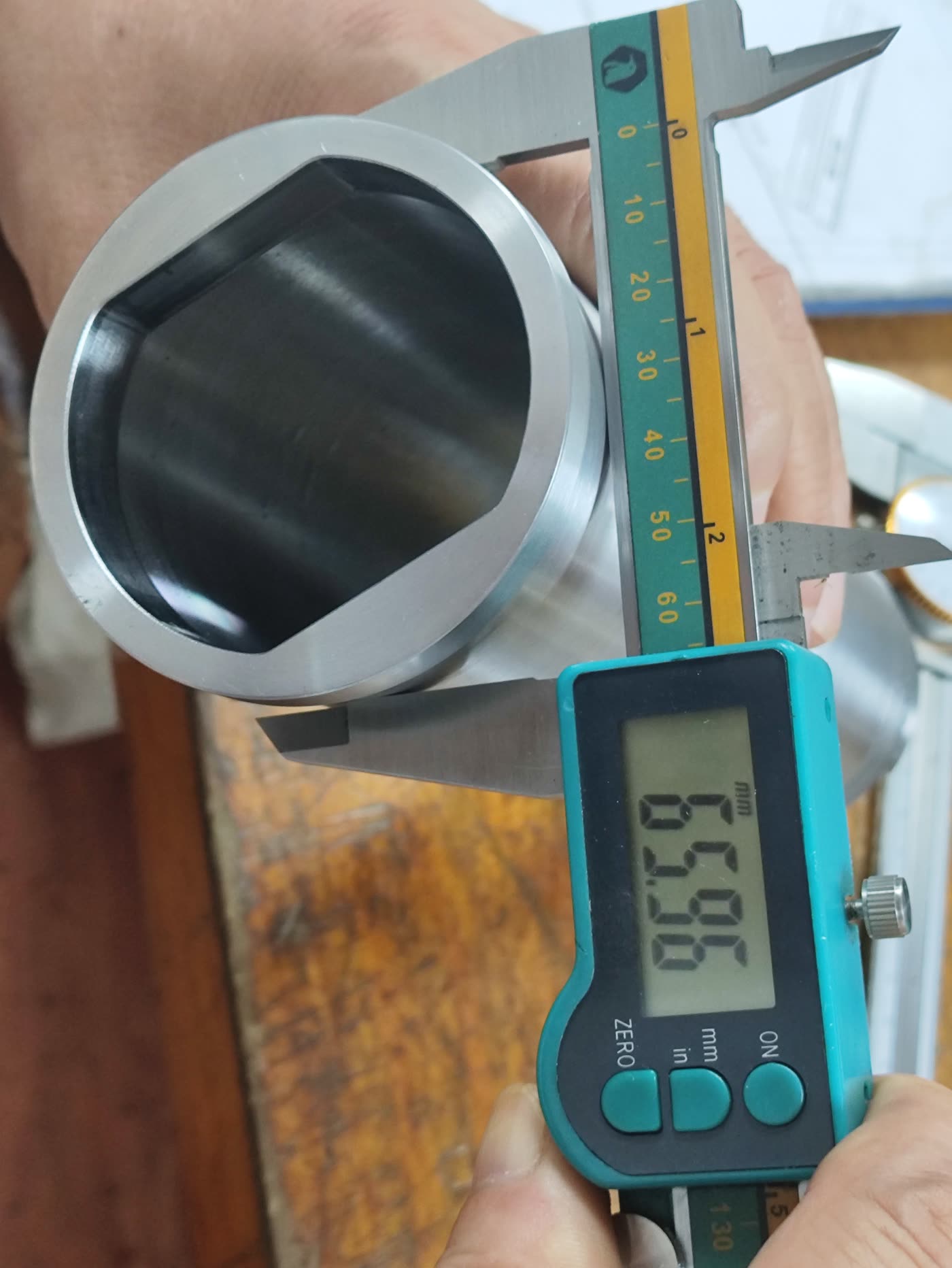Digital caliper checking a bore diameter