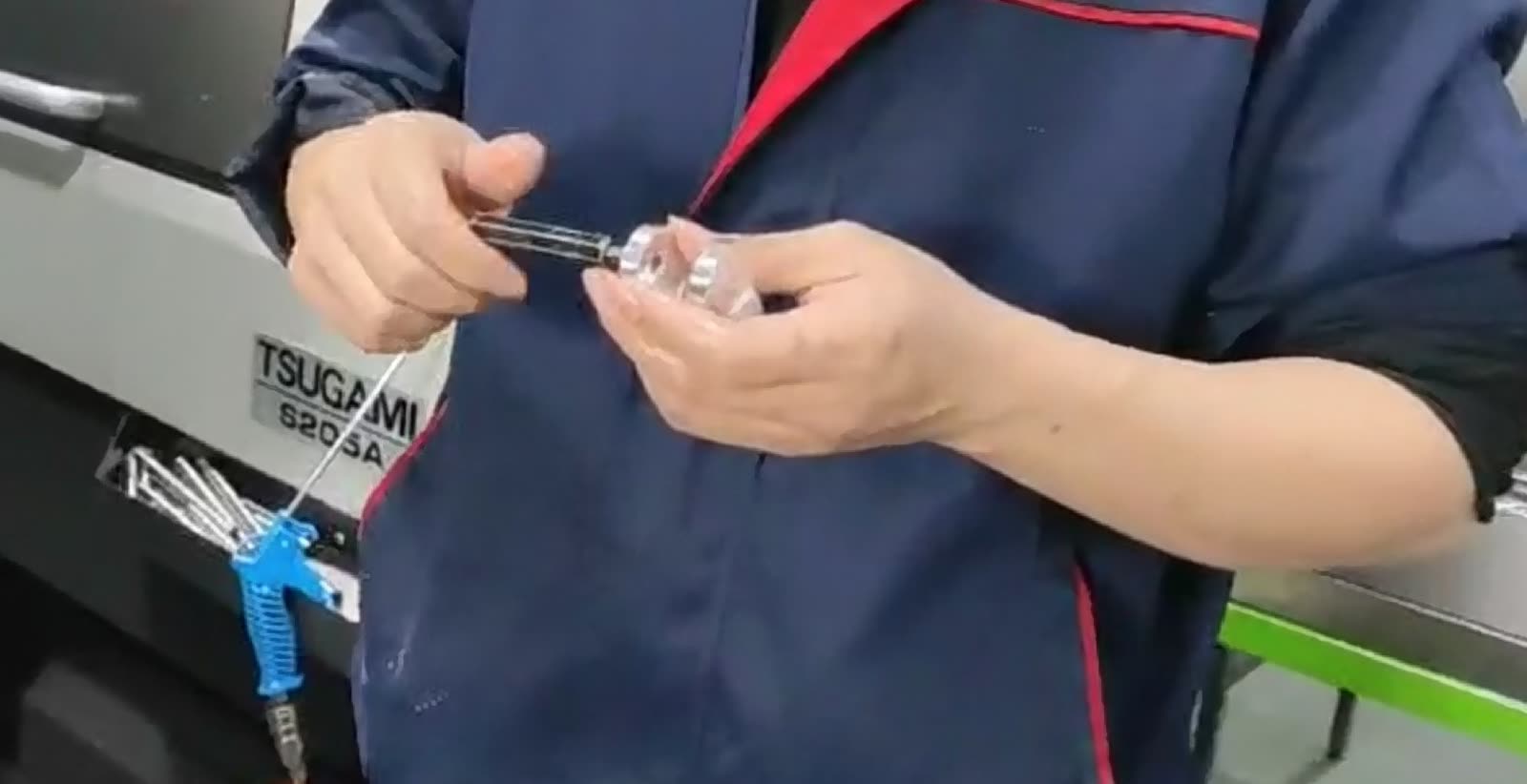 Operator checking a small part with a gauge